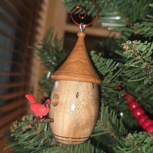 Charming Wooden Birdhouse with Red Bird Accent